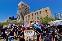 FILE - Protesters rally, June 3, 2020, in Phoenix, demanding that the Phoenix City Council defund the Phoenix Police Department.