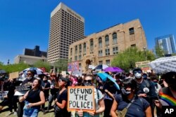 FILE - Protesters rally, June 3, 2020, in Phoenix, demanding that the Phoenix City Council defund the Phoenix Police Department.