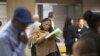 FILE - Malana Long fills out a job application during a job fair for the homeless at the Los Angeles Mission in the Skid Row area of Los Angeles, California, June 4, 2015. The number of people signing up for unemployment benefits in the United States fell to a 42-year low last week.