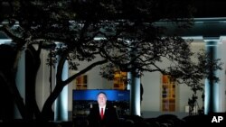 A video of Secretary of State Mike Pompeo speaking during the Republican National Convention plays from the Rose Garden of the White House, Aug. 25, 2020, in Washington. 