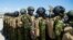 Kenyan police officers arrive at Toussaint Louverture International Airport in Port-au-Prince, Haiti, on Feb. 6, 2025.