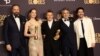Yorgos Lanthimos, Emma Stone, Willem Dafoe, Mark Ruffalo and Ramy Youssef with the award for Best Motion Picture - Musical or Comedy award and Best Performance by a Female Actor in a Motion Picture - Musical or Comedy for "Poor Things," Jan. 7, 2024.