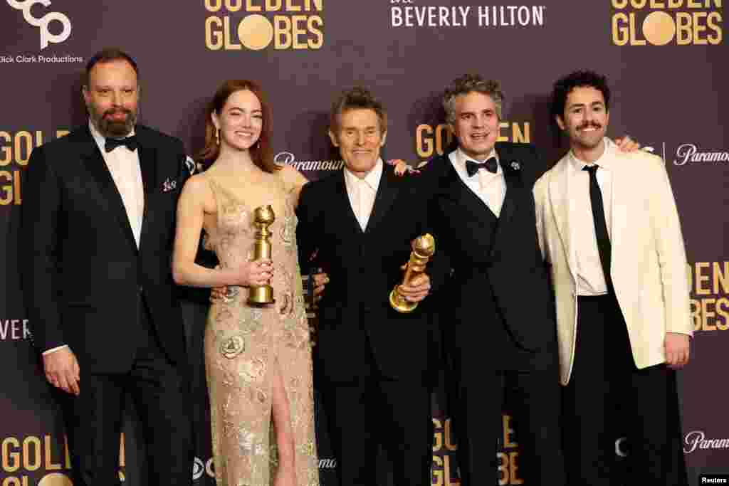 Yorgos Lanthimos, Emma Stone, Willem Dafoe, Mark Ruffalo and Ramy Youssef pose with the award for Best Motion Picture - Musical or Comedy award for &quot;Poor Things&quot;, and Best Performance by a Female Actor in a Motion Picture - Musical or Comedy for &quot;Poor Things&quot;, at the 81st Annual Golden Globe Awards Jan. 7, 2024.