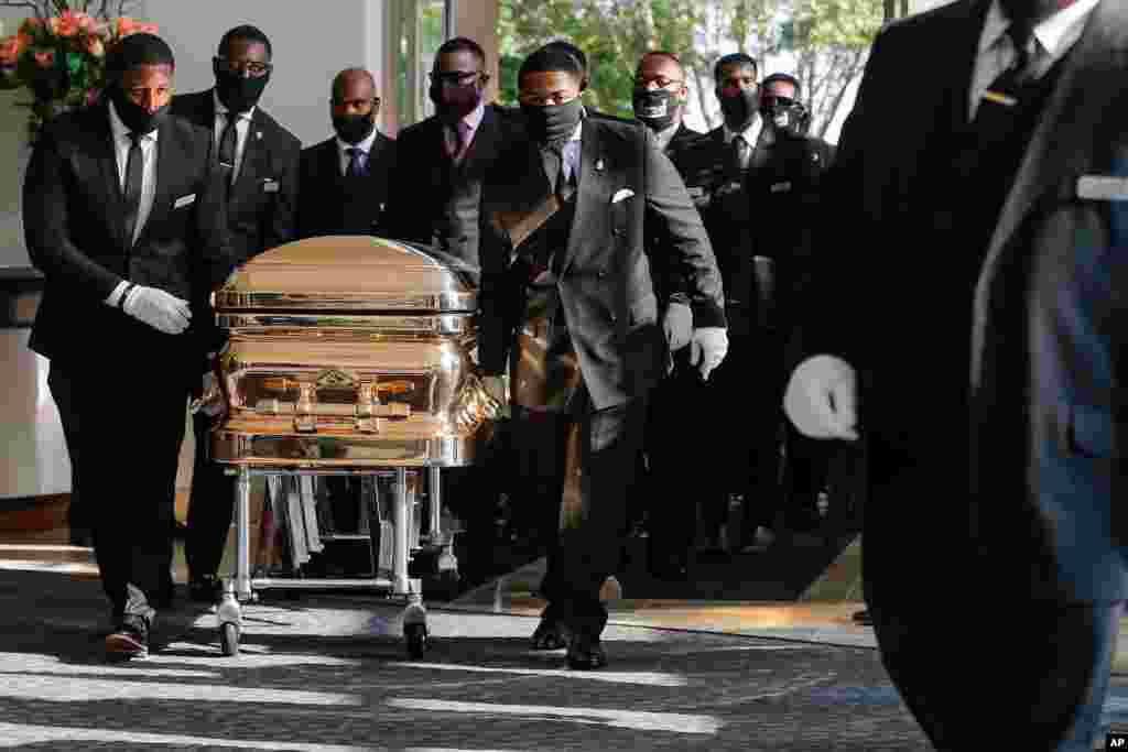 Pallbearers bring the coffin into The Fountain of Praise church in Houston for the funeral for George Floyd on June 9, 2020.