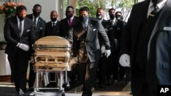 Pallbearers bring the coffin into The Fountain of Praise church in Houston for the funeral for George Floyd on June 9, 2020.