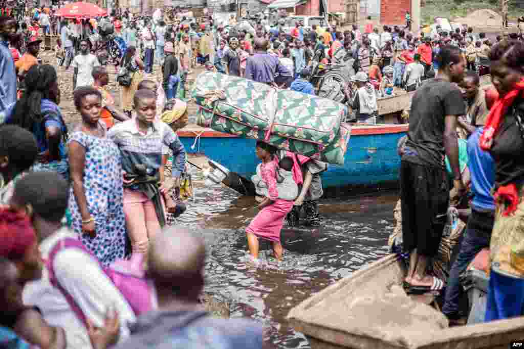 Congolese displaced fleeing the area of Minova leave the port of Nzulo to seek shelter in Goma Democratic Republic of Congo.&nbsp;The Congolese army said that M23 fighters had made a &quot;breakthrough&quot; in the east of the country after the armed group seized Minova, a trading hub that supplies the city of Goma.