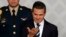 Mexico's President Enrique Pena Nieto gestures during an event with lawyers in Mexico City, Nov. 21, 2014. 