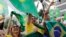 Supporters of Brazilian presidential candidate Jair Bolsonaro cheer as they gather outside his residence in Rio de Janeiro, Brazil, Sunday, Oct. 28, 2018, during the country's presidential runoff election. 