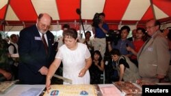 FILE - David Odgen Stiers cuts the cake during a ceremony marking the close of the last Mobile Army Surgical Hospital (MASH) in Pyongtaek, South Korea .