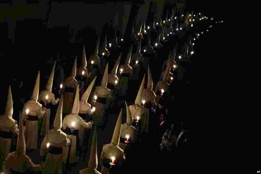 Penitents of the Jesus Yacente brotherhood take part in a Holy Week procession in Zamora, Spain, April 3, 2015. 