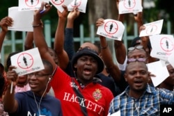 FILE - People protest against underage marriages in Lagos, Nigeria, July 20, 2013.