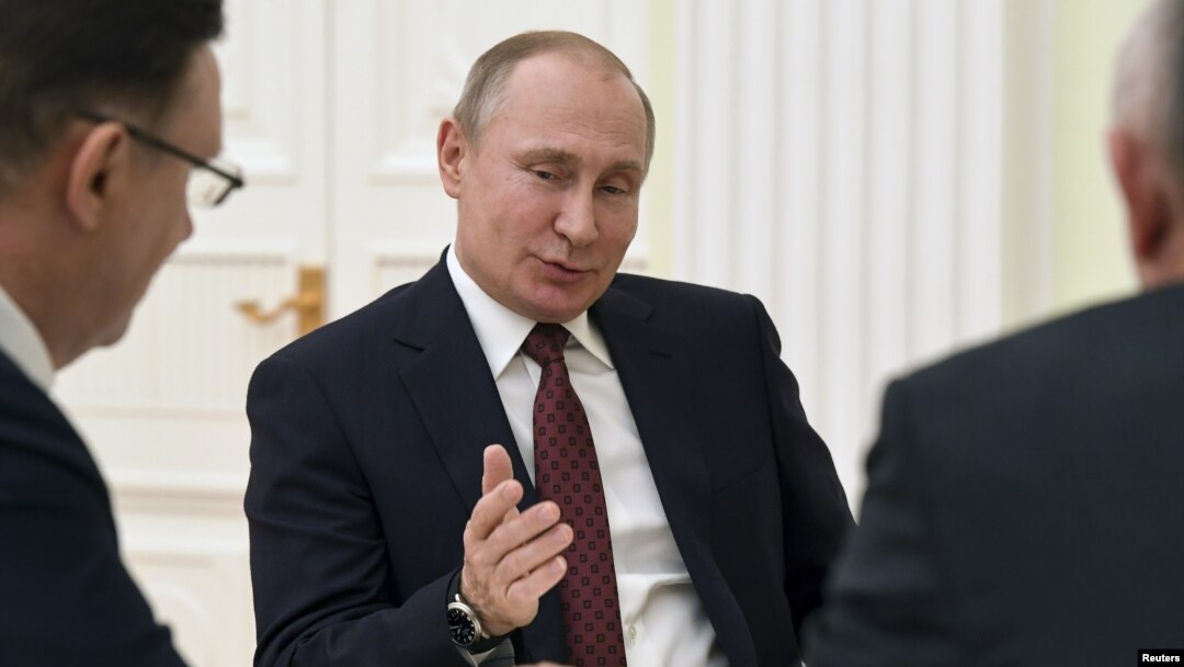 Russian President Vladimir Putin meets with co-chairs of his campaign office at the Kremlin in Moscow, March 19, 2018.