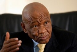 FILE - Lesotho's Prime Minister Tom Thabane gestures as he speaks at State House in Maseru, Lesotho, Feb. 27, 2015.
