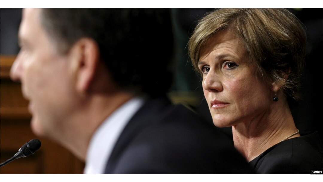 FILE - Then-Deputy Attorney General Sally Quillian Yates (R) listens as FBI Director James Comey speaks during a Senate Judiciary Committee hearing in Washington.