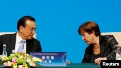 2019 年11 月21 日，在中國北京釣魚台國賓館舉行的“1+6”圓桌會議之後的新聞發布會上，國際貨幣基金組織（IMF）總裁克里斯塔利娜·格奧爾基耶娃與中國總理李克強進行了會談。