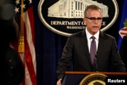 Acting FBI Director Andrew McCabe holds a press conference in Washington.
