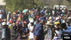 Members of Zimbabwe’s ruling Zanu PF party – mainly youths - waiting for President Robert Mugabe to address them at a football stadium in Lupane, about 600 km southwest of Zimbabwe's capital (S. Mhofu/VOA)