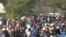 Members of Zimbabwe’s ruling Zanu PF party – mainly youths - waiting for President Robert Mugabe to address them at a football stadium in Lupane, about 600km south west of Zimbabwe's capital (S. Mhofu/VOA)