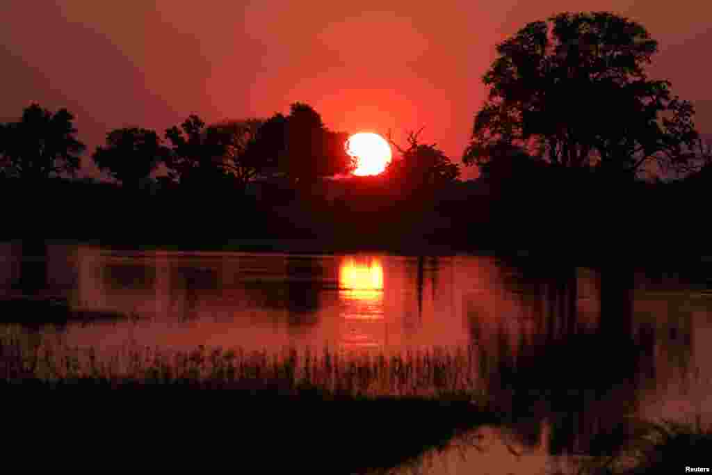 The sun sets over the Okavango Delta, Botswana.