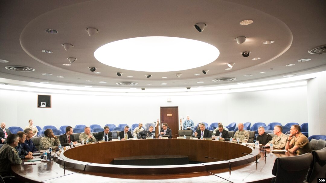 FILE - Secretary of Defense Ash Carter meets with Adm. Mike Rogers and his senior staff members at the National Security Agency headquarters on Fort Meade, Md., March 13, 2015.