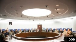 FILE - Secretary of Defense Ash Carter meets with Adm. Mike Rogers and his senior staff members at the National Security Agency headquarters on Fort Meade, Md., March 13, 2015.