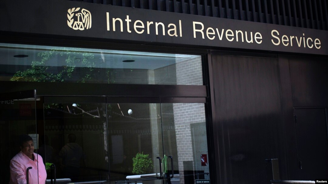 A woman walks out of the Internal Revenue Service building in New York, May 13, 2013.