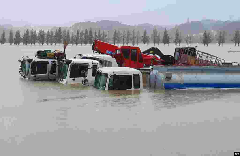 Trucks and vehicles are seen inundated by floodwaters from heavy rains caused by Typhoon Mitag in Gangneung. Six people were killed and several others went missing as Typhoon Mitag lashed the southern and eastern regions of South Korea, Yonhap reported.