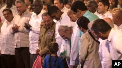 Cuban Leader Fidel Castro, center, talks with a girl during a gala for his 90th birthday at the 'Karl Marx' theater in Havana, Cuba, Saturday, Aug. 13, 2016. 