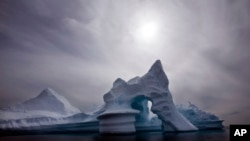 FILE - In this July 19, 2007 file photo an iceberg is seen off Ammassalik Island in Eastern Greenland. The Arctic is a thermostat against overheating and a barometer of change, but now its own protective ozone layer that keeps out damaging ultraviolet radiation has thinned to rec