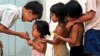 Cambodian orphans play together as they wait for adoption at Kien Klaing orphanage center in Phnom Penh, (File photo). 