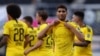 Bek Dortmund asal Maroko, Achraf Hakimi, memperlihatkan kaus "Keadilan untuk George Floyd" setelah mencetak gol keempat bagi timnya dalam pertandingan sepak bola Bundesliga divisi satu Jerman SC Paderborn 07 dan Borussia Dortmund di Benteler Arena di Paderborn, 31 Mei 2020.