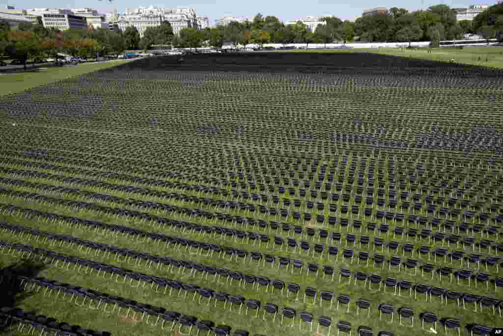 Hundreds of empty chairs representing a fraction of the more than 200,000 lives lost due to COVID-19, are seen during the National COVID-19 Remembrance outside the South side of the White House, Oct. 4, 2020, in Washington.