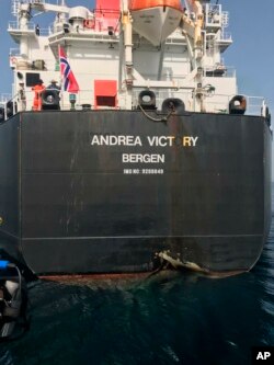 This photo provided by the United Arab Emirates' National Media Council shows the Norwegian-flagged oil tanker MT Andrea Victory off the coast of Fujairah, United Arab Emirates, May 13, 2019.