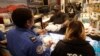 Chef Creole owner Wilkinson Sejour hands out free hot meals to TSA workers at his restaurant at Miami International Airport, Jan. 15, 2019, in Miami. 