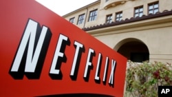 FILE - A sign points to Netfilx headquarters in Los Gatos, Calif. Netflix.