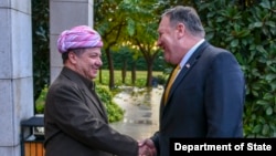 FILE - Kurdistan Regional Government Prime Minister-designate Masoud Barzani, left, meets with U.S. Secretary of State Mike Pompeo in Erbil, Iraq, on Jan. 9, 2019.