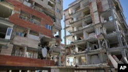 Buildings are damaged by an earthquake in a compound which was built under the Mehr state-owned program, in Sarpol-e-Zahab in western Iran, Nov. 14, 2017.