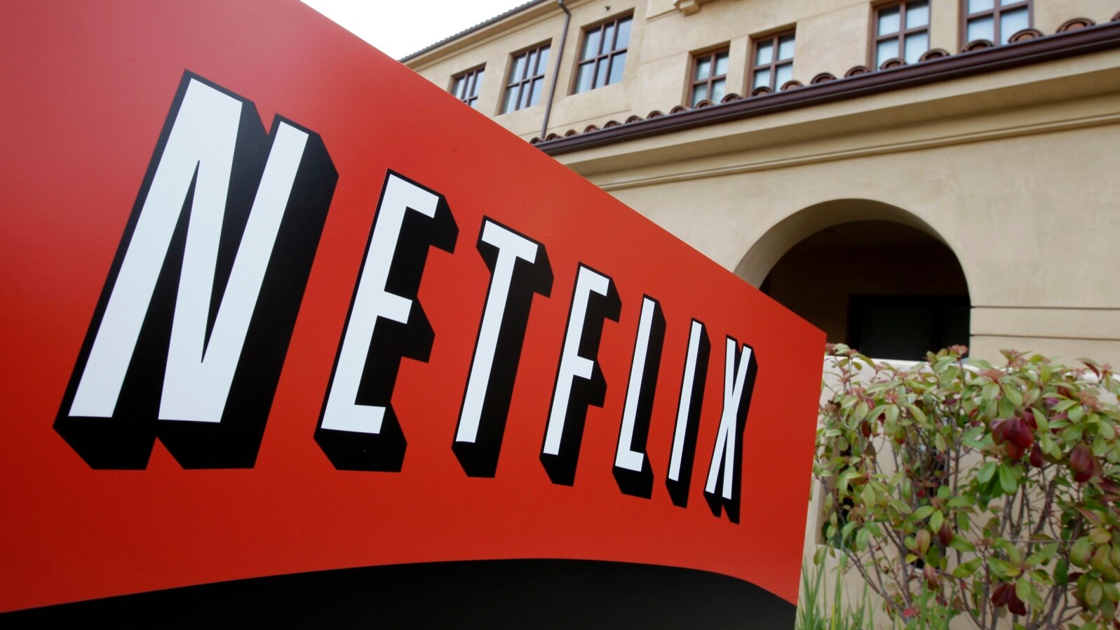 FILE - A sign points to Netfilx headquarters in Los Gatos, Calif. Netflix.