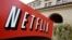 FILE - A sign points to Netfilx headquarters in Los Gatos, Calif. Netflix.