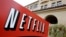 FILE - A sign points to Netfilx headquarters in Los Gatos, Calif. Netflix.