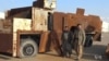 Kurdish Peshmerga commanders display on Dec. 23, 2015, heavily-fortified military equipment seized from IS during earlier battles.