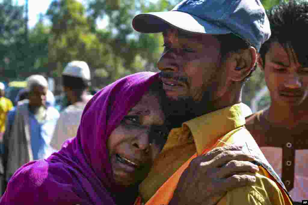 A Rohingya refugee woman who is among those being moved to an island called &lsquo;Bhasan Char&rsquo; cries outside a transit area where they are temporally housed in Ukhiya, Bangladesh.
