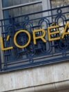 FILE - The logo of French cosmetics group L'Oreal is seen on a company building in Paris, France, Feb. 7, 2024. L'Oreal is among cosmetics companies in France hoping to minimize the impact of harsh new Chinese import rules.