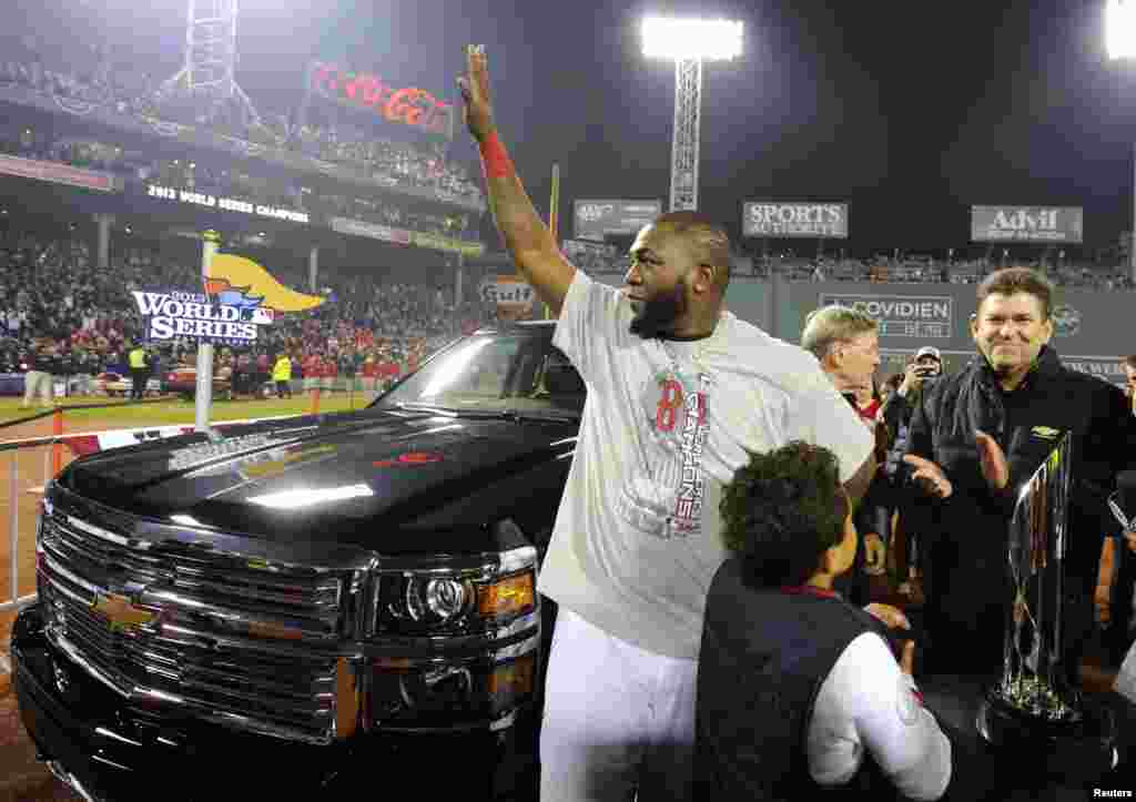 Oct 30, 2013; Boston, MA, USA; Boston Red Sox designated hitter David Ortiz waves to the crowd after being named series MVP after game six of the MLB baseball World Series against the St. Louis Cardinals at Fenway Park. The Red Sox won 6-1 to win the seri