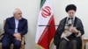 FILE - Iranian Supreme Leader Ayatollah Ali Khamenei and Foreign Minister Mohammad Javad Zarif attend a government meeting in Tehran, July 15, 2018.