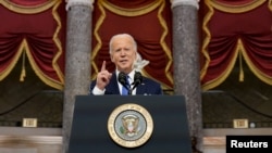 President Joe Biden speaks in Statuary Hall on the first anniversary of the Jan. 6, 2021 attack on the US Capitol by supporters of former President Donald Trump, Jan. 6, 2022.