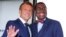 French President Emmanuel Macron, left, welcomes African Development Bank president Akinwumi Adesina upon his arrival in Biarritz, France, Aug. 25, 2019.