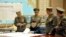 North Korean leader Kim Jong Un (C) presides over an urgent operation meeting on the Korean People's Army Strategic Rocket Force's performance of duty for firepower strike, at the Supreme Command in Pyongyang, March 29, 2013.