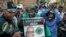 Supporters of South Africa's uMkhonto weSizwe (MK) political party protest in Johannesburg, outside the constitutional court, following the ruling that declared their leader former president Jacob Zuma ineligible as a candidate in the upcoming elections.