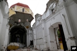Santiago Apostol church was destroyed during the recent 7.1-magnitude earthquake, in Atzala, Mexico, Sept. 23, 2017.